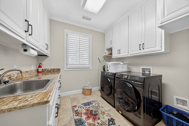 1102 Silverton Dr, Midland, TX 79705 - laundry area with cabinet space, washer and clothes dryer, and ornamental molding