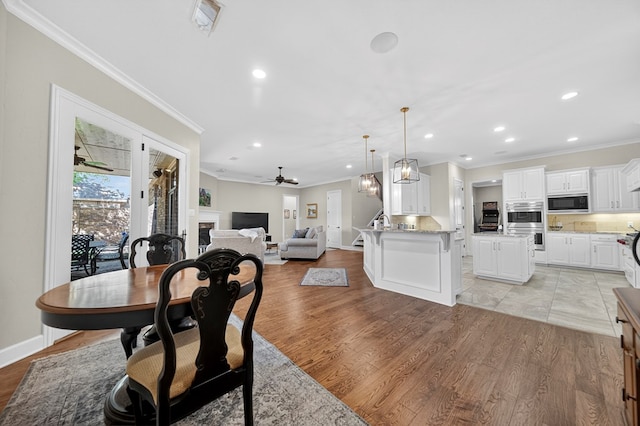 1102 Silverton Dr, Midland, TX 79705 - dining space featuring crown molding, recessed lighting, light wood finished floors, and a ceiling fan