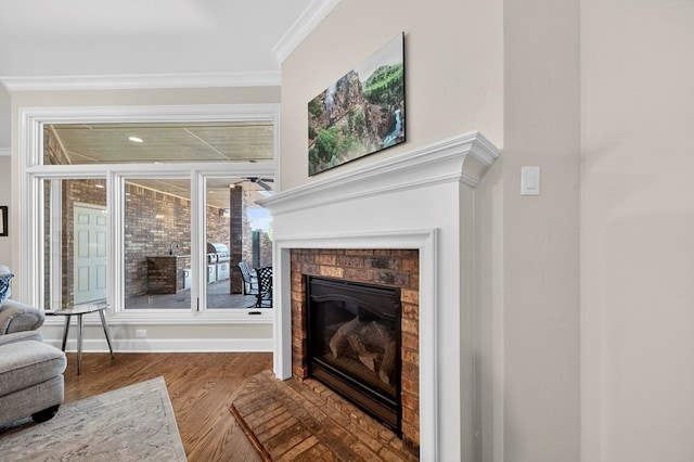 1102 Silverton Dr, Midland, TX 79705 - living room featuring crown molding, a glass covered fireplace, and wood finished floors