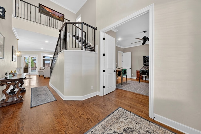 1102 Silverton Dr, Midland, TX 79705 - foyer entrance featuring crown molding, wood finished floors, stairs, ceiling fan, and recessed lighting