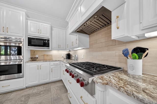1102 Silverton Dr, Midland, TX 79705 - kitchen with appliances with stainless steel finishes, custom exhaust hood, ornamental molding, white cabinetry, and decorative backsplash