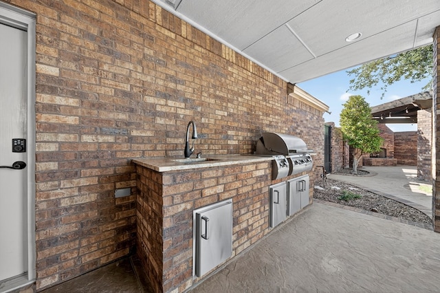 1102 Silverton Dr, Midland, TX 79705 - view of patio featuring a sink and an outdoor kitchen
