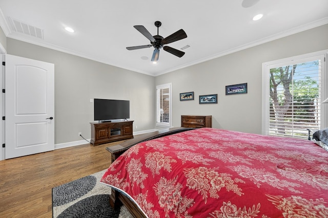 1102 Silverton Dr, Midland, TX 79705 - bedroom with wood finished floors, crown molding, recessed lighting, and a ceiling fan