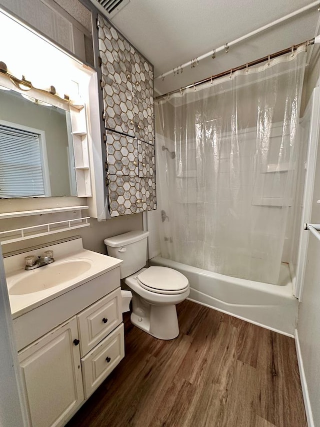 full bathroom featuring shower / bath combination with curtain, wood-type flooring, toilet, and vanity