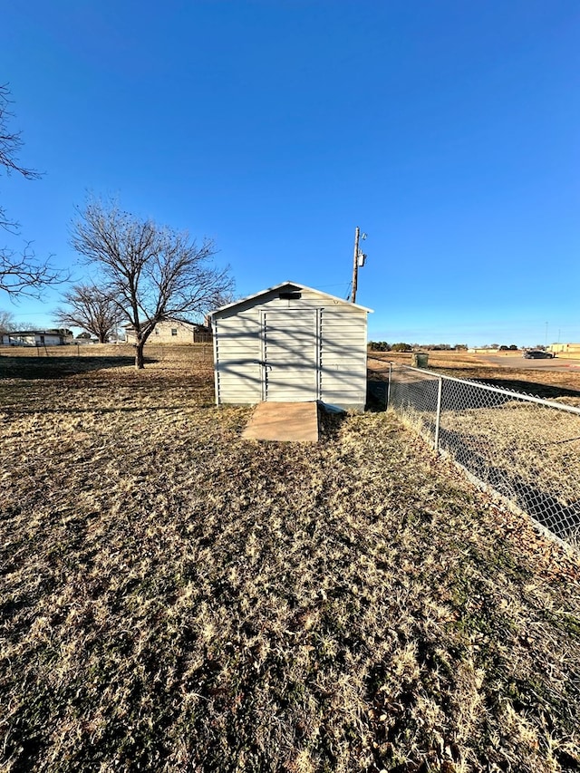 view of outbuilding featuring a rural view