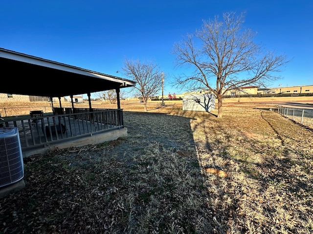 view of yard featuring an outdoor structure and cooling unit