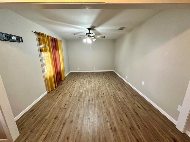 unfurnished room with hardwood / wood-style flooring and ceiling fan