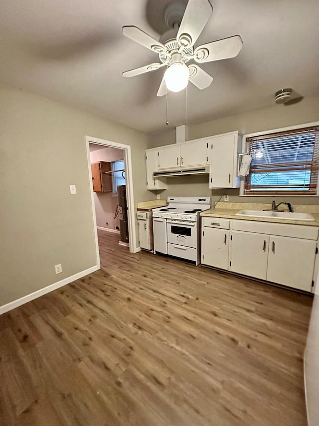 kitchen with sink, white electric range, light hardwood / wood-style flooring, and white cabinets