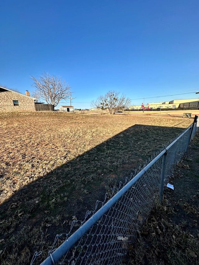 view of yard with a rural view