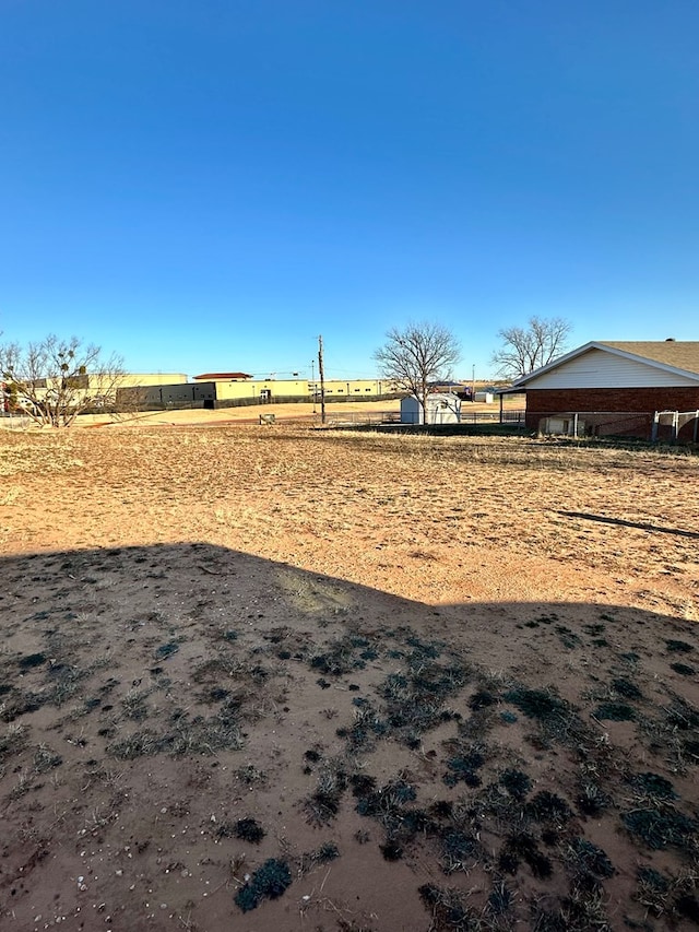 view of yard with a rural view