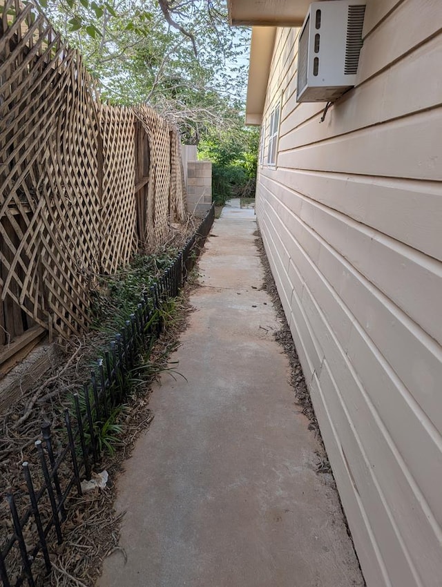view of side of home with fence