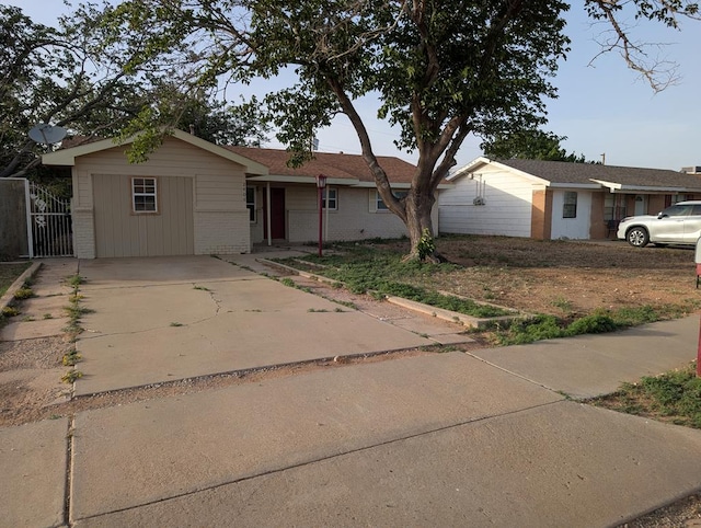 ranch-style house with brick siding and concrete driveway
