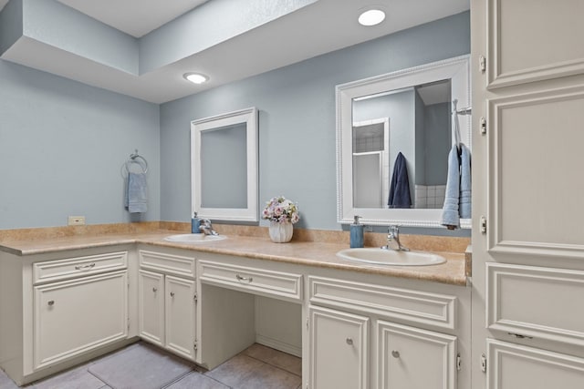 2821 Goddard Pl, Midland, TX 79705 - full bathroom with double vanity, tile patterned flooring, and a shower