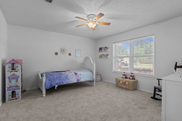 2821 Goddard Pl, Midland, TX 79705 - carpeted bedroom with a textured ceiling, a ceiling fan, and baseboards