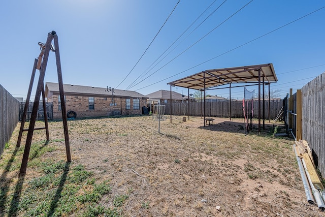 view of yard with a fenced backyard