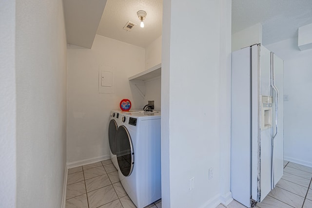 laundry area with visible vents, baseboards, laundry area, washer and dryer, and marble finish floor