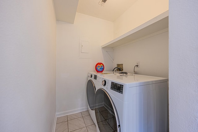 washroom featuring washing machine and clothes dryer, visible vents, baseboards, laundry area, and marble finish floor