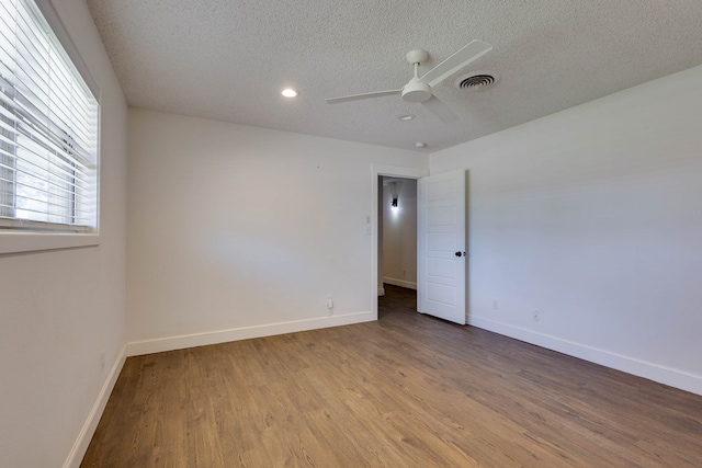 709 21st St, Lamesa, TX 79331 - spare room with ceiling fan, a textured ceiling, wood finished floors, and recessed lighting