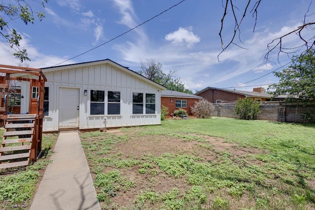 709 21st St, Lamesa, TX 79331 - back of house featuring board and batten siding