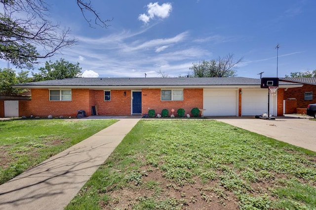 709 21st St, Lamesa, TX 79331 - ranch-style home featuring a garage, brick siding, concrete driveway, and a front yard