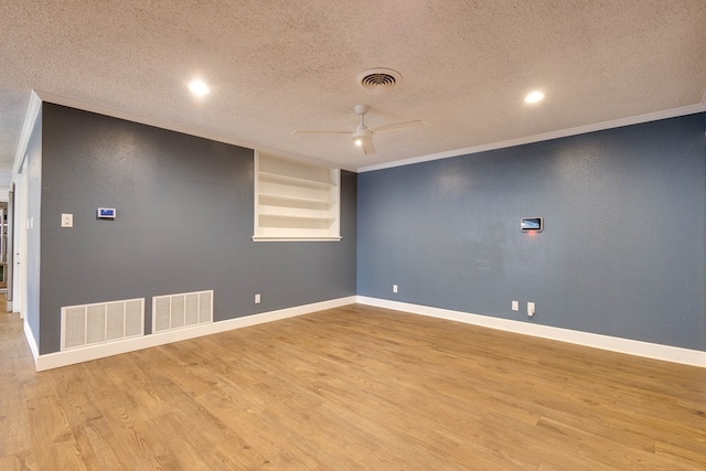 709 21st St, Lamesa, TX 79331 - empty room with ceiling fan, a textured ceiling, wood finished floors, ornamental molding, and recessed lighting