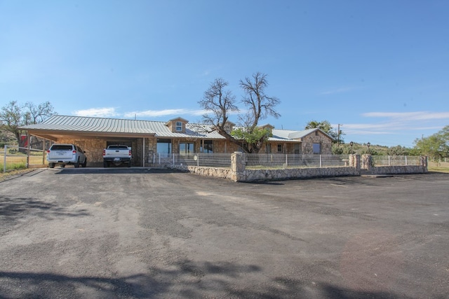 view of front of property featuring a carport