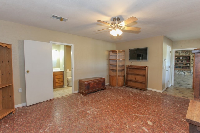 living room featuring a textured ceiling and ceiling fan