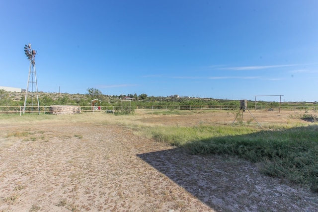 view of yard with a rural view