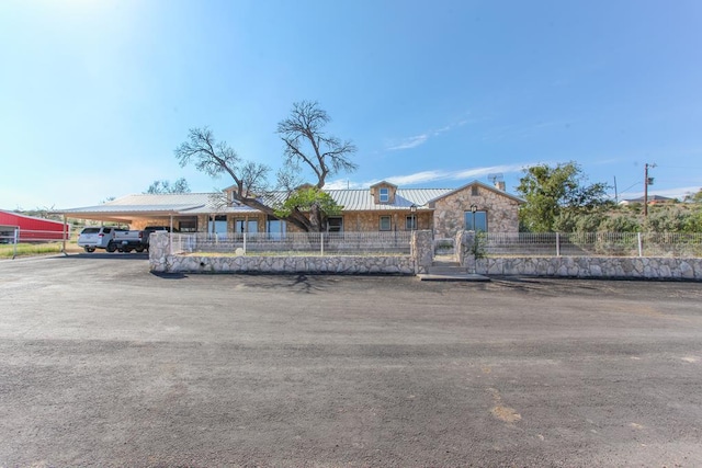 view of front of property with a carport