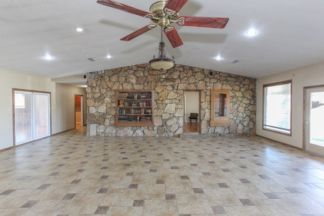 unfurnished living room with ceiling fan, lofted ceiling, and a textured ceiling