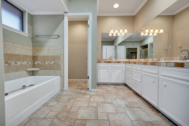 bathroom with vanity, a bathtub, and ornamental molding