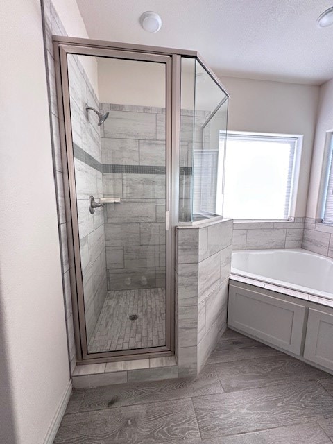 3210 Fordham Ave, Big Spring, TX 79720 - full bathroom featuring a garden tub and a shower stall