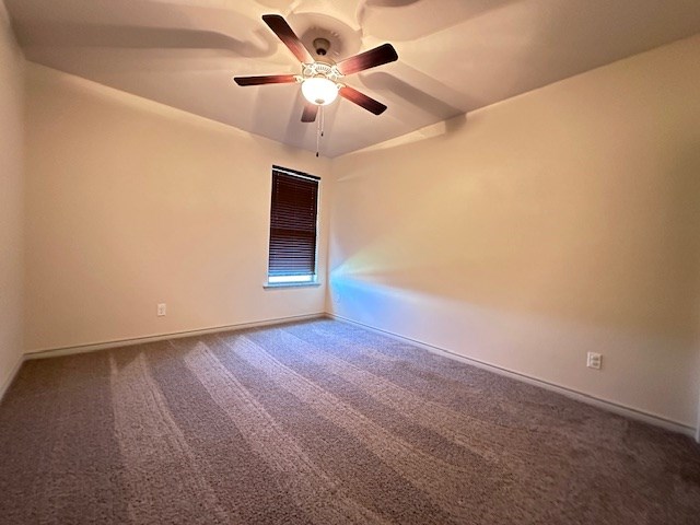 3210 Fordham Ave, Big Spring, TX 79720 - unfurnished room with carpet and ceiling fan