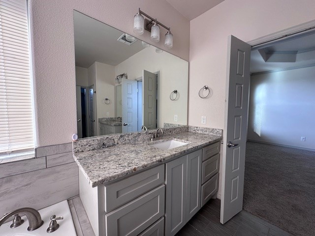 3210 Fordham Ave, Big Spring, TX 79720 - full bathroom featuring vanity and a bathtub