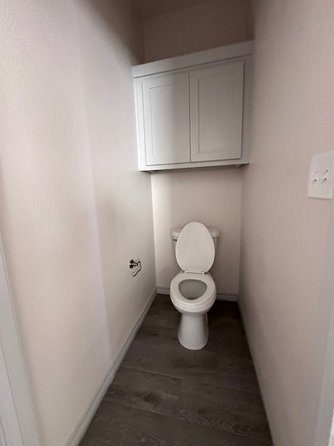 3210 Fordham Ave, Big Spring, TX 79720 - bathroom with wood finished floors and toilet