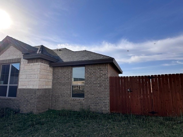 3210 Fordham Ave, Big Spring, TX 79720 - view of property exterior with brick siding and roof with shingles