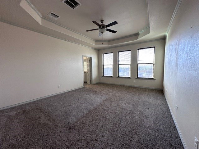 3210 Fordham Ave, Big Spring, TX 79720 - unfurnished room with a raised ceiling, ornamental molding, carpet flooring, and a ceiling fan