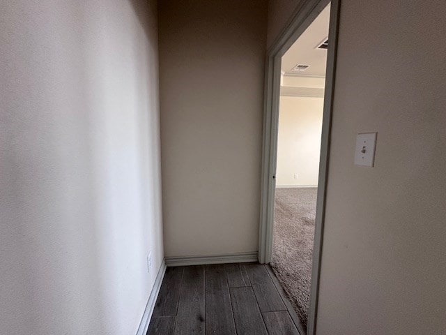 3210 Fordham Ave, Big Spring, TX 79720 - corridor with dark wood-style flooring and baseboards