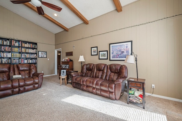carpeted living area featuring ceiling fan, high vaulted ceiling, beam ceiling, and baseboards