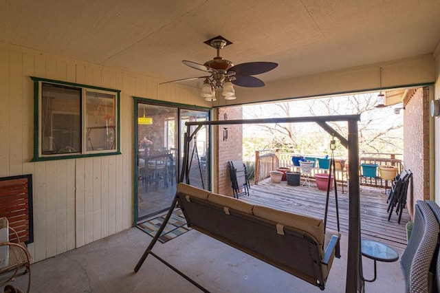 sunroom / solarium with ceiling fan