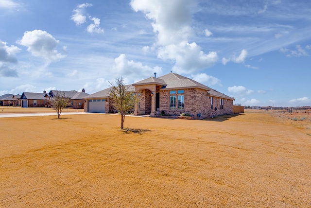 view of front of property featuring driveway and an attached garage