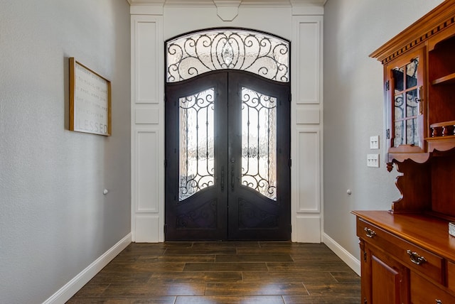 entryway with french doors, baseboards, and dark wood-style floors