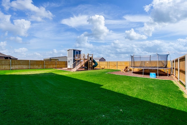 1602 S County Rd 1069, Midland, TX 79706 - view of yard with a trampoline and a playground