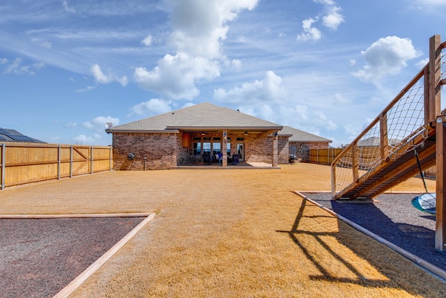 view of yard with a patio area, stairway, and a fenced backyard