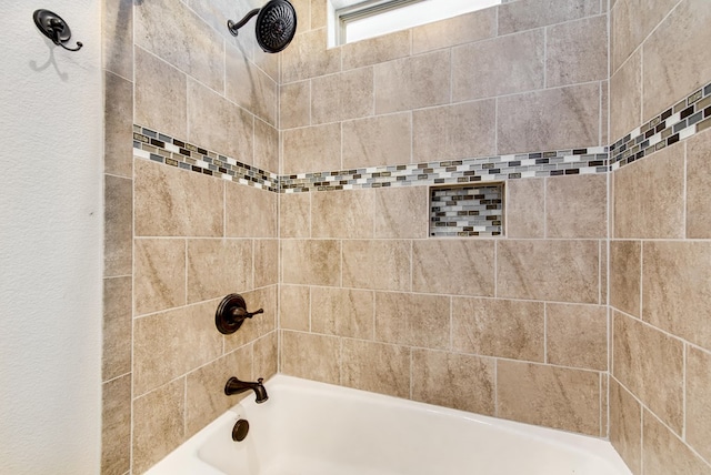 bathroom with tub / shower combination