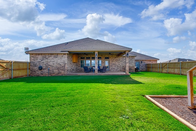 1602 S County Rd 1069, Midland, TX 79706 - back of property with a ceiling fan, a patio, a shingled roof, and brick siding