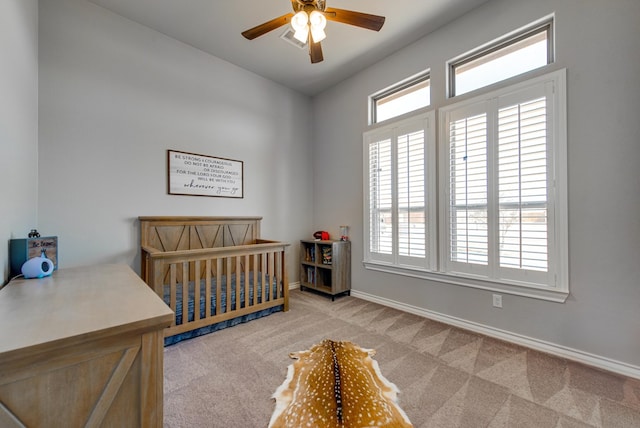 1602 S County Rd 1069, Midland, TX 79706 - carpeted bedroom with baseboards, a nursery area, vaulted ceiling, and a ceiling fan