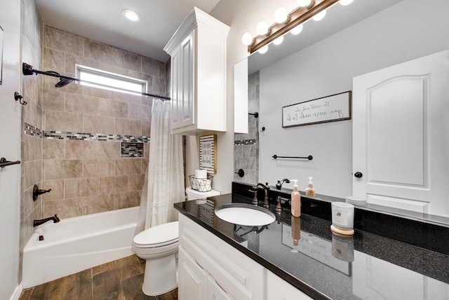 bathroom featuring vanity, shower / bathtub combination with curtain, toilet, and wood finished floors