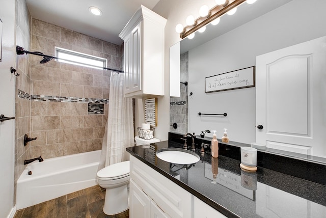 1602 S County Rd 1069, Midland, TX 79706 - full bath featuring vanity, toilet, shower / bath combo, wood finished floors, and recessed lighting