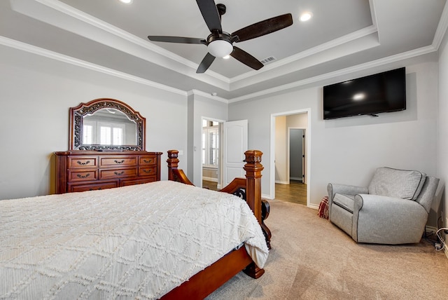 bedroom featuring visible vents, carpet flooring, crown molding, and a tray ceiling